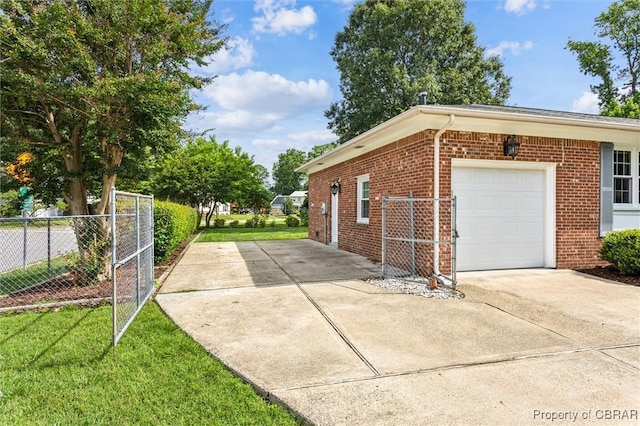 1 Beacon Cir, Hampton, VA 23664 - view of side of property with brick siding, concrete driveway, and a garage