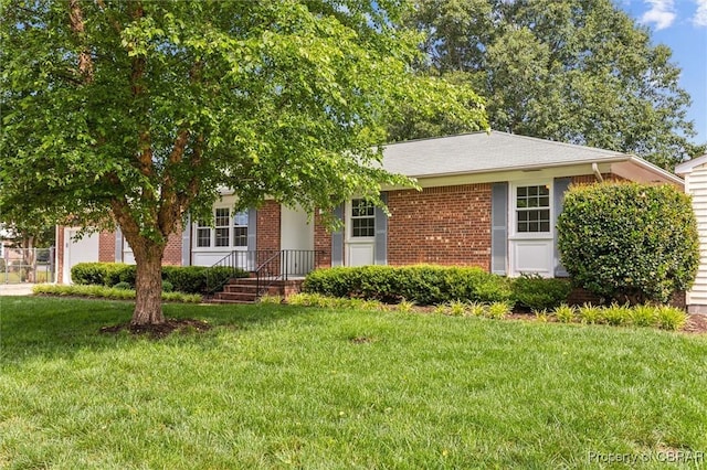 1 Beacon Cir, Hampton, VA 23664 - obstructed view of property with a front lawn and brick siding