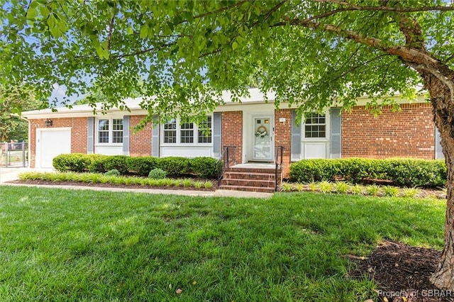 1 Beacon Cir, Hampton, VA 23664 - view of front of home with a front yard, brick siding, and a garage