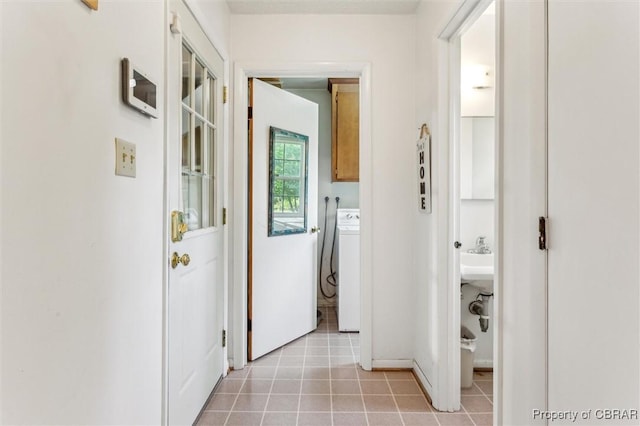 1 Beacon Cir, Hampton, VA 23664 - hallway featuring washer / clothes dryer, light tile patterned floors, and baseboards