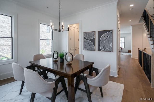 425 W 7th St, Richmond, VA 23224 - dining area with a chandelier, wood finished floors, baseboards, ornamental molding, and stairs