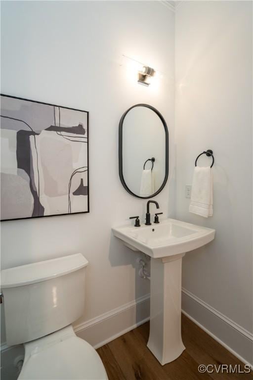 425 W 7th St, Richmond, VA 23224 - half bath featuring baseboards, wood finished floors, and toilet