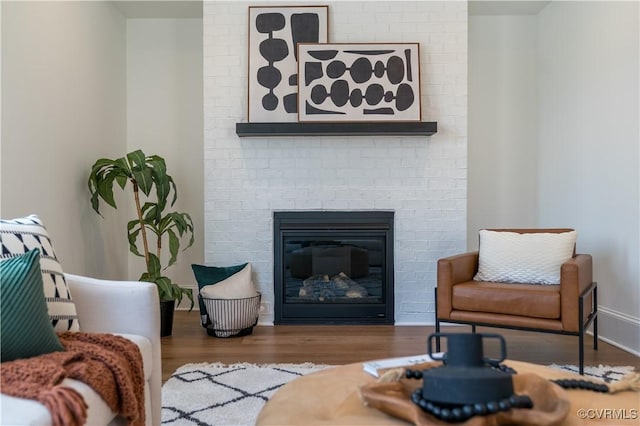 425 W 7th St, Richmond, VA 23224 - living area featuring wood finished floors and a fireplace