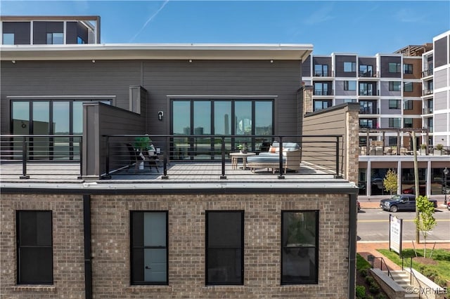 425 W 7th St, Richmond, VA 23224 - rear view of house featuring a balcony and brick siding