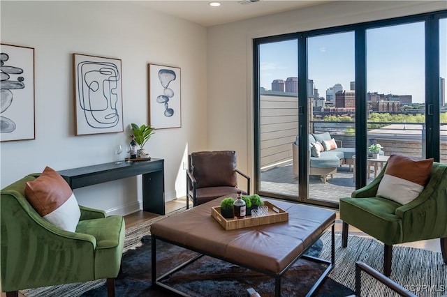 425 W 7th St, Richmond, VA 23224 - living area featuring wood finished floors, recessed lighting, a view of city, and baseboards