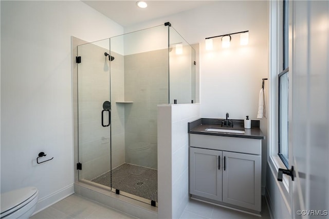 425 W 7th St, Richmond, VA 23224 - full bathroom with a stall shower, toilet, tile patterned flooring, vanity, and recessed lighting