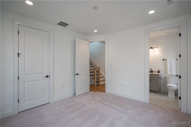 425 W 7th St, Richmond, VA 23224 - unfurnished bedroom with carpet, recessed lighting, baseboards, ensuite bathroom, and a sink