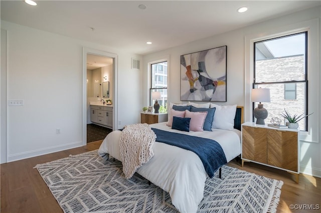 425 W 7th St, Richmond, VA 23224 - bedroom featuring wood finished floors, baseboards, ensuite bathroom, and recessed lighting