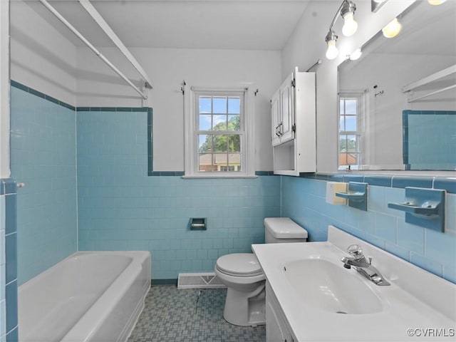 3301 Warsaw Ave, Hopewell, VA 23860 - bathroom featuring healthy amount of natural light, tile walls, vanity, and wainscoting