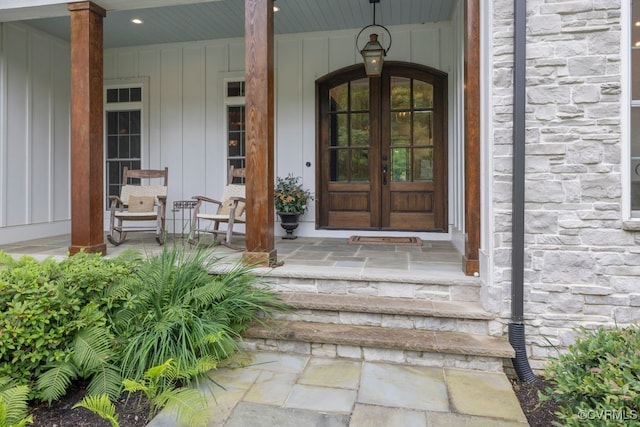547 River Rd, Manakin Sabot, VA 23103 - property entrance featuring stone siding, a porch, and french doors