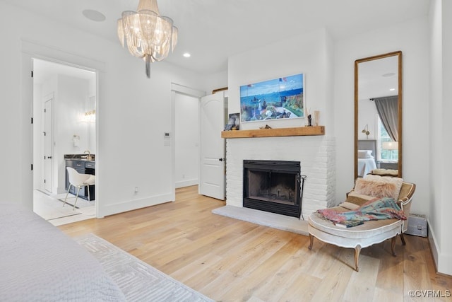 547 River Rd, Manakin Sabot, VA 23103 - living room with wood finished floors, a chandelier, a brick fireplace, and recessed lighting