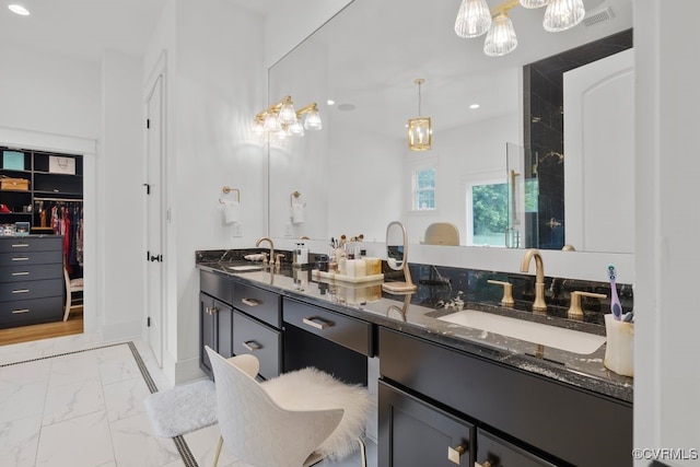 547 River Rd, Manakin Sabot, VA 23103 - bathroom featuring marble finish floors, double vanity, a chandelier, recessed lighting, and tiled shower