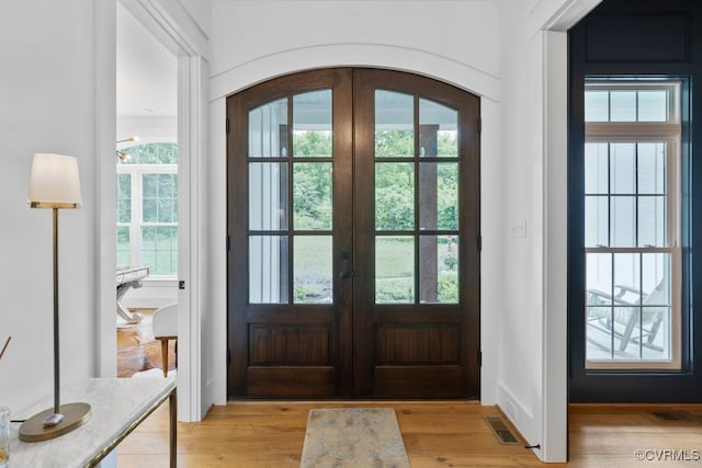 547 River Rd, Manakin Sabot, VA 23103 - foyer entrance featuring french doors, light wood-type flooring, and arched walkways
