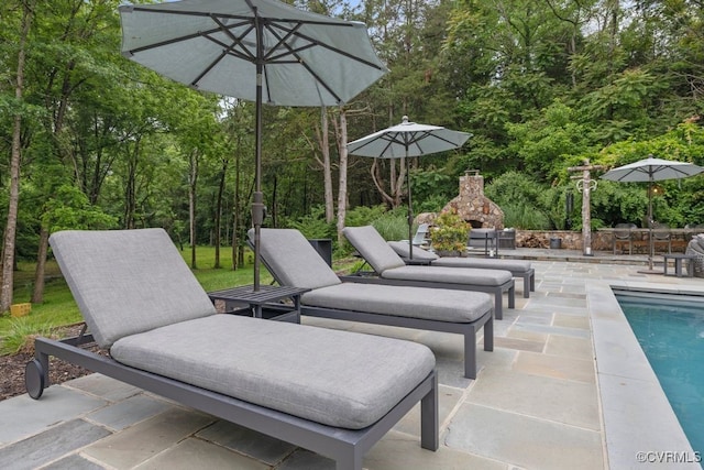 547 River Rd, Manakin Sabot, VA 23103 - view of patio / terrace with an outdoor stone fireplace and an outdoor pool