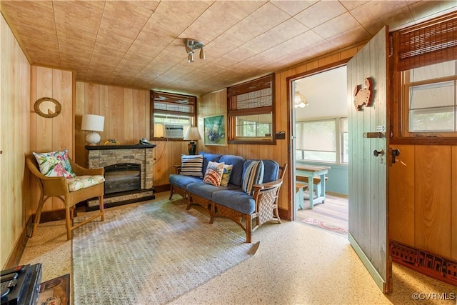 198 Trices Lake Rd, Columbia, VA 23038 - sitting room with wooden walls, plenty of natural light, a fireplace, and cooling unit