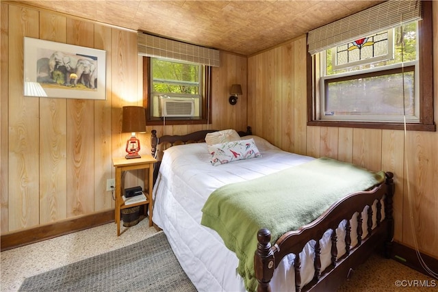 198 Trices Lake Rd, Columbia, VA 23038 - bedroom featuring cooling unit, wood walls, and multiple windows