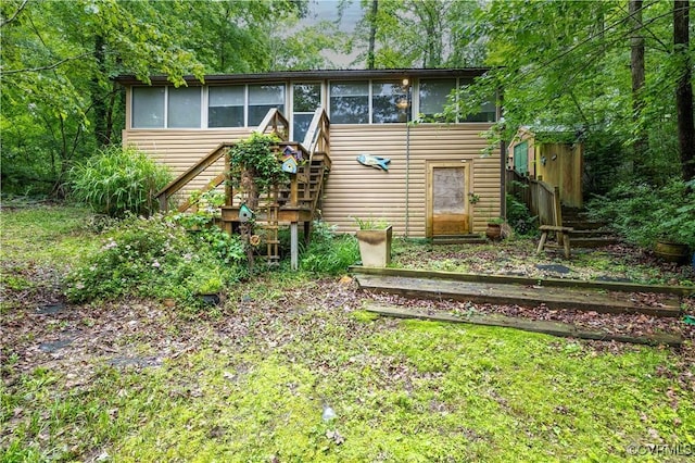 198 Trices Lake Rd, Columbia, VA 23038 - back of house featuring a sunroom and stairway