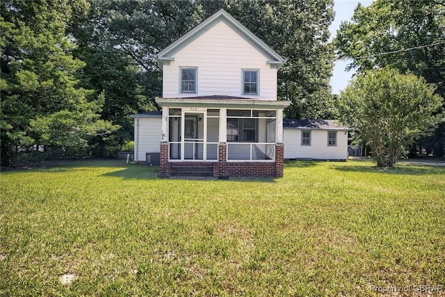 708 Calthrop Neck Rd, Yorktown, VA 23693 - rear view of property featuring a yard and a sunroom