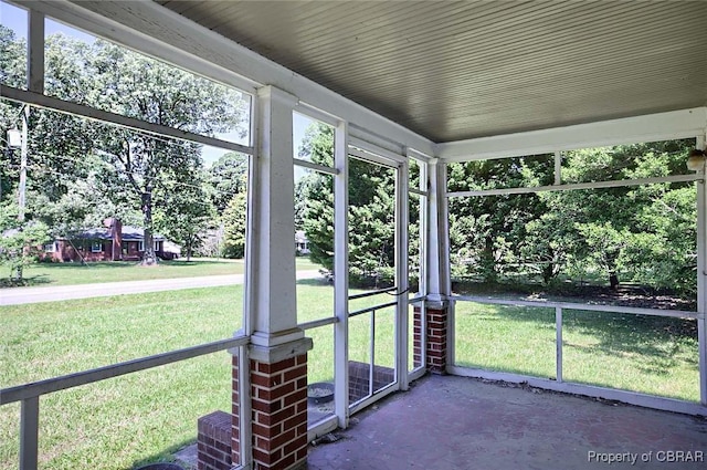 708 Calthrop Neck Rd, Yorktown, VA 23693 - unfurnished sunroom with view of scattered trees