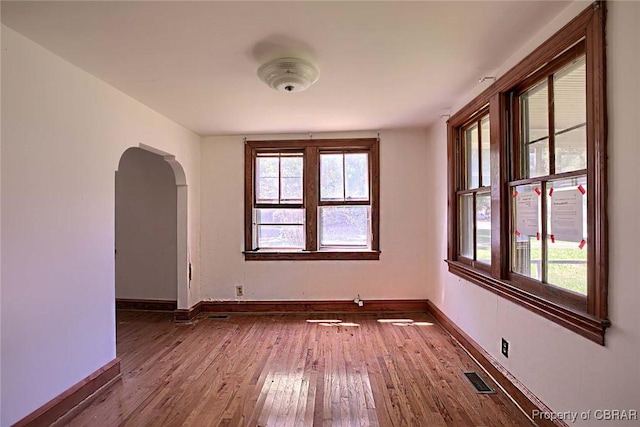 708 Calthrop Neck Rd, Yorktown, VA 23693 - spare room featuring dark wood-type flooring and arched walkways