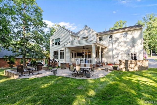 14469 St Andrews Ln, Ashland, VA 23005 - rear view of house featuring a ceiling fan, a patio area, and a yard