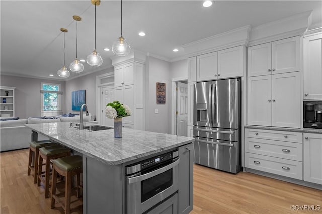 14469 St Andrews Ln, Ashland, VA 23005 - kitchen with stainless steel appliances, a sink, ornamental molding, open floor plan, and light stone countertops