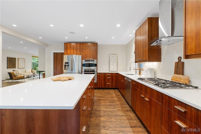 322 Charmian Rd, Richmond, VA 23226 - kitchen featuring wall chimney exhaust hood, appliances with stainless steel finishes, modern cabinets, a sink, and recessed lighting