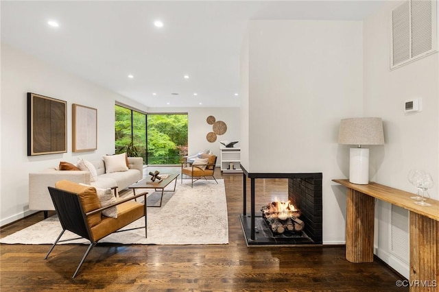 322 Charmian Rd, Richmond, VA 23226 - living area with wood finished floors, recessed lighting, a multi sided fireplace, and baseboards