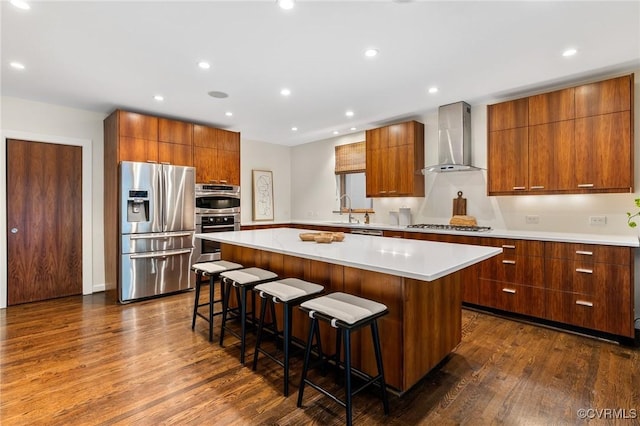 322 Charmian Rd, Richmond, VA 23226 - kitchen featuring stainless steel appliances, wall chimney exhaust hood, modern cabinets, a kitchen island, and recessed lighting