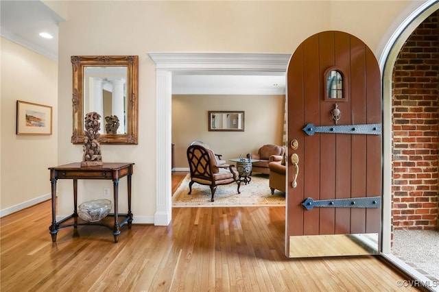 561 Hill Grove Rd, Manakin Sabot, VA 23103 - entryway with hardwood / wood-style floors, baseboards, arched walkways, and ornamental molding