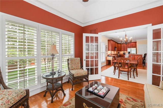 561 Hill Grove Rd, Manakin Sabot, VA 23103 - living area featuring plenty of natural light, a chandelier, ornamental molding, and light wood-type flooring