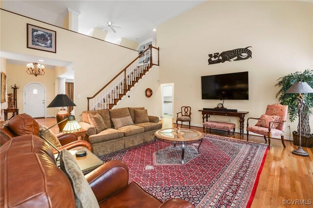 561 Hill Grove Rd, Manakin Sabot, VA 23103 - living area with wood finished floors, a ceiling fan, baseboards, stairway, and a high ceiling