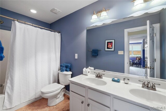 561 Hill Grove Rd, Manakin Sabot, VA 23103 - bathroom featuring double vanity, toilet, shower / tub combo, and tile patterned floors