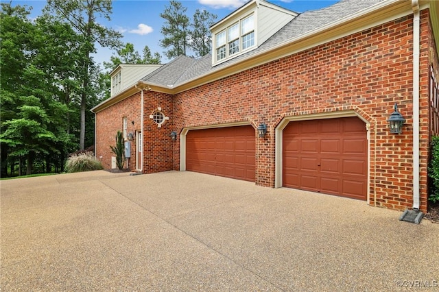561 Hill Grove Rd, Manakin Sabot, VA 23103 - view of property exterior with brick siding, concrete driveway, and a shingled roof
