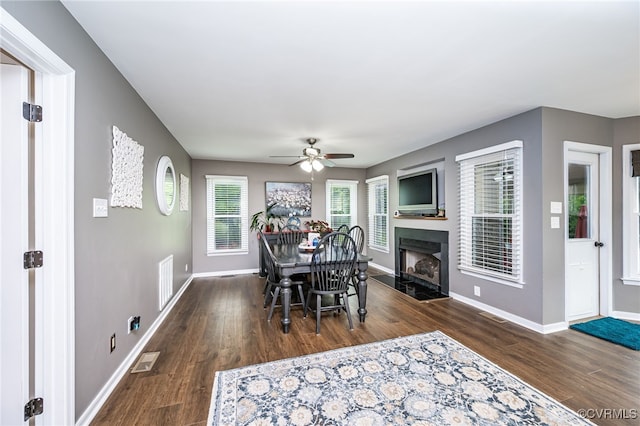 16397 Goshen Rd, Montpelier, VA 23192 - dining space with wood finished floors, a ceiling fan, baseboards, and a fireplace