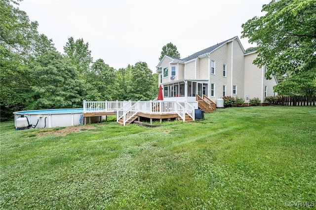 16397 Goshen Rd, Montpelier, VA 23192 - back of house featuring a sunroom, a wooden deck, an outdoor pool, and stairway