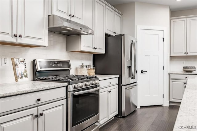 6 Abercrombie Dr, Chesterfield, VA 23838 - kitchen featuring appliances with stainless steel finishes, under cabinet range hood, dark wood-style flooring, tasteful backsplash, and light stone counters