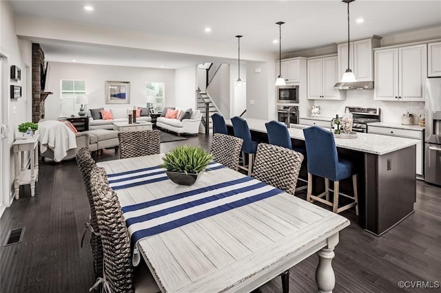 6 Abercrombie Dr, Chesterfield, VA 23838 - dining space featuring stairs, recessed lighting, and dark wood-style floors
