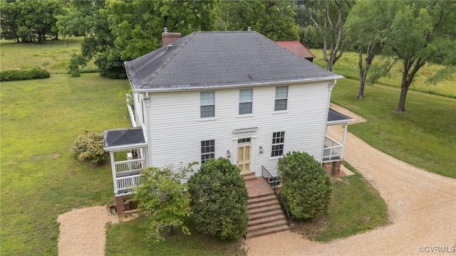 9341 Varina Rd, Henrico, VA 23231 - colonial house featuring a chimney, a front yard, and driveway