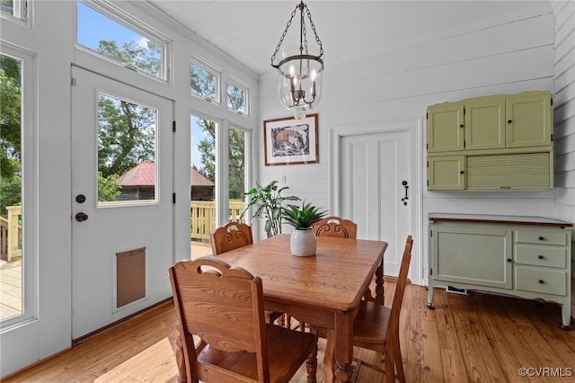 9341 Varina Rd, Henrico, VA 23231 - dining area featuring light wood-style flooring, a chandelier, and crown molding