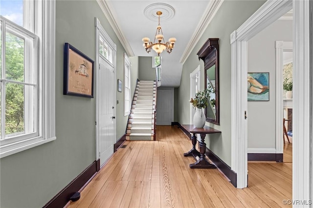 9341 Varina Rd, Henrico, VA 23231 - foyer entrance with stairs, a chandelier, plenty of natural light, light wood-type flooring, and ornamental molding