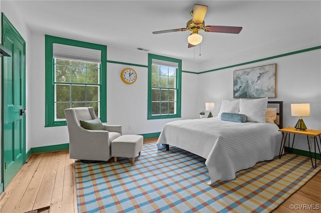 9341 Varina Rd, Henrico, VA 23231 - bedroom featuring baseboards, light wood-style floors, and multiple windows