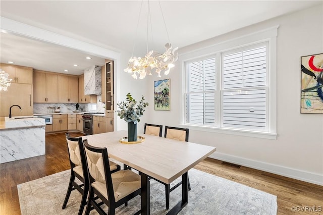 109 Libbie Ave, Richmond, VA 23226 - dining room with a chandelier, dark wood finished floors, healthy amount of natural light, and recessed lighting