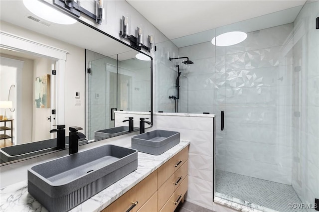 109 Libbie Ave, Richmond, VA 23226 - bathroom with a shower stall and double vanity