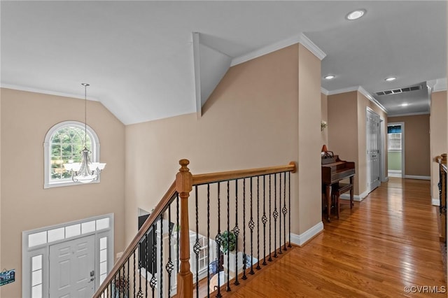 9085 Winter Spring Dr, Mechanicsville, VA 23116 - hall featuring an upstairs landing, wood finished floors, ornamental molding, baseboards, and a chandelier