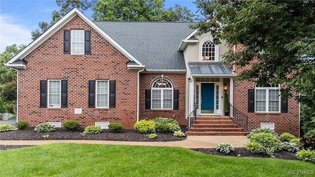 9085 Winter Spring Dr, Mechanicsville, VA 23116 - traditional-style home with brick siding, roof with shingles, a front yard, and entry steps