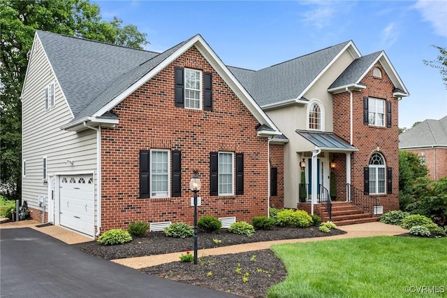 9085 Winter Spring Dr, Mechanicsville, VA 23116 - traditional-style home featuring an attached garage, brick siding, asphalt driveway, and crawl space