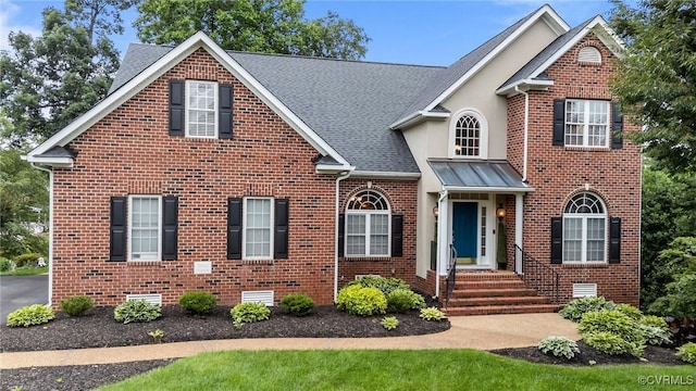 9085 Winter Spring Dr, Mechanicsville, VA 23116 - traditional-style house with brick siding and roof with shingles