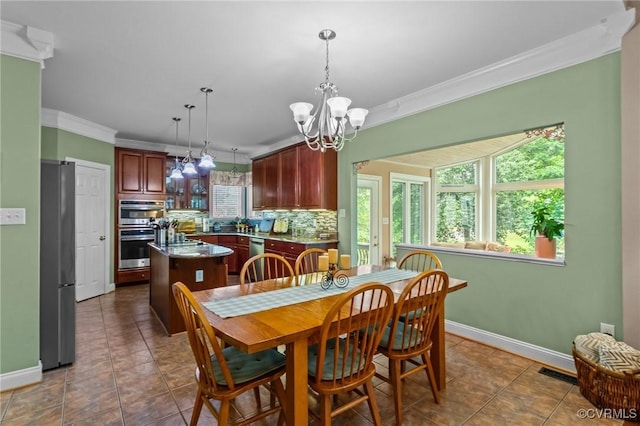 9085 Winter Spring Dr, Mechanicsville, VA 23116 - dining area with crown molding, a chandelier, baseboards, and tile patterned floors