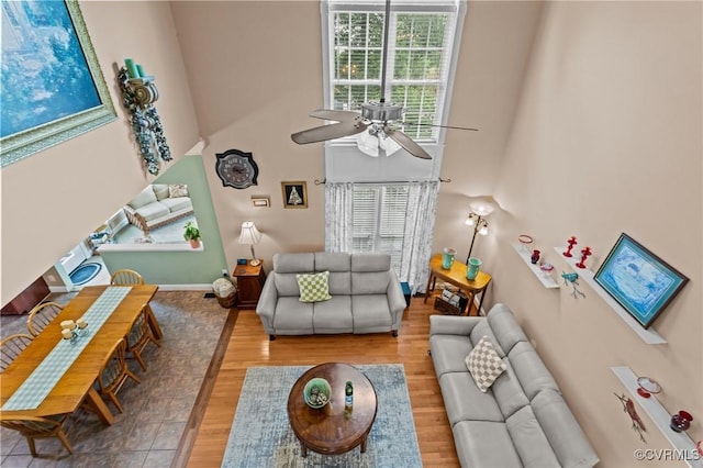 9085 Winter Spring Dr, Mechanicsville, VA 23116 - living room with ceiling fan, a high ceiling, wood finished floors, and baseboards